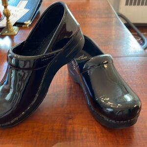 Dansko black patent leather clogs, size 9